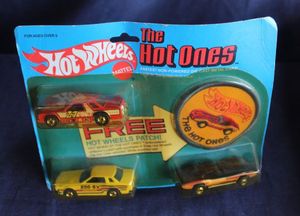 lot 28 image: 1981 Hot Wheels The Hot Ones 3-Car Set featuring a Datsun 200-sx, 76 Corvette Stingray and a Front Runnin Fairmont.