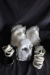 lot 73 image: Bulk lot of Phantom of the Opera masks and rubber bracelets