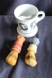lot 105 image: Vintage Shaving mug and lather brushes set
