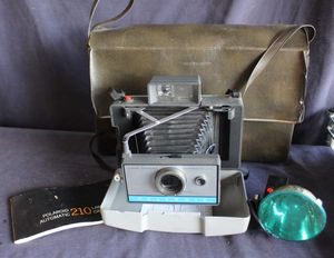 lot 108 image: Polaroid Automativ 210 Land Camera including a flashgun Orginal carrying case and instruction manual