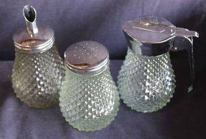 lot 110 image: Vintage Indiana Glass Clear Diamond Point 3-Piece Set featuring a syrup dispenser, sugar dispenser, and salt shaker.