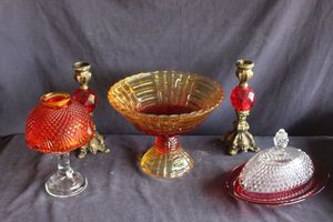 lot 142 image: L.E. Smith Amberina glass fairy lamp in pineapple pattern, yellow and red compote bowl, Vintage Indiana Glass Diamond Point Ruby Flash oval covered butter dish from the 1960s. Two Vintage style candlesticks.