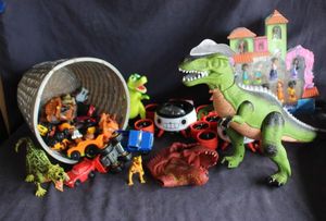 lot 160 image: Dinosaurs, cars and more (basket not included)