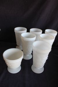lot 306 image: Vintage Anchor Hocking Milk Glass footed tumblers featuring raised grape vine design
