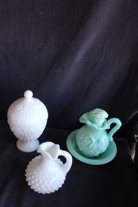 lot 313 image: Vintage Avon Jadeite slag glass decanter with matching basin, white hobnail pitcher and hobnail lidded trinket box