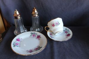 lot 319 image: Porcelain tea set and salt and pepper shakers