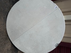 lot 232 image: six foot round table with  folding legs has hole in top