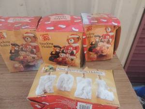 lot 57 image: 3 bear stocking holders and Noel candle holders