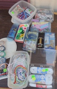 lot 143 image: Elastic, bobbins, tape ,bells, etc.