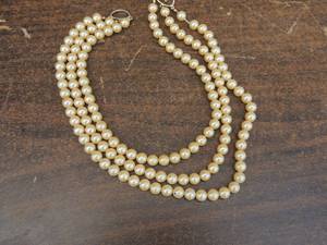lot 11 image: Faux pearl necklace double strand