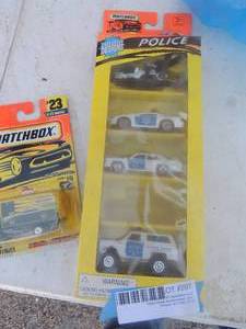 lot 297 image: Matchbox cars plus set of police cars