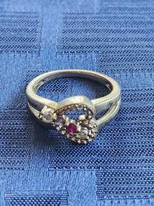 lot 26 image: Heart shaped ring with 4 stones - marked 925 silver