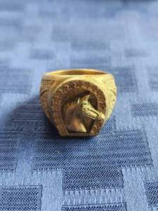 lot 62 image: Gold horse head ring - marked 18k - 27g -