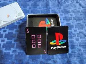 lot 54 image: Set of PlayStation playing cards in metal tin