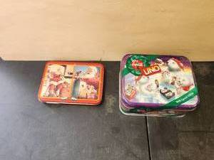 lot 101 image: Selection of playing cards in metal tins - unused