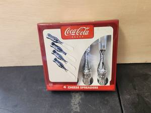 lot 105 image: Coca Cola bottle designed cheese spreaders - unused