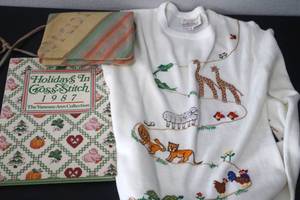 lot 51 image: Holiday Kids Sweater (M), Handbag and Cross Stich Book