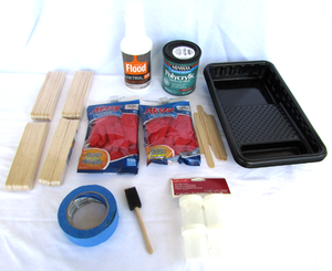 lot 513 image: Assorted painting supplies, stir sticks, painters tape, gloves and more