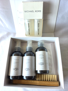 lot 545 image: Michael Kors leather care kit, UGG leather care kit
