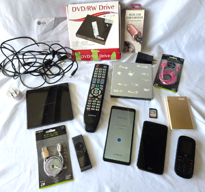 lot 551 image: Assorted electronics, LG cell phone (working), DVDRW drive, remote control and more