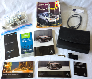 lot 570 image: Genuine Mercedes Benz leather auto manual case plus manuals and more