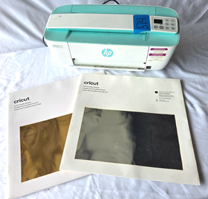 lot 574 image: Cricut foil transfer sheets and HP Deskjet 3755