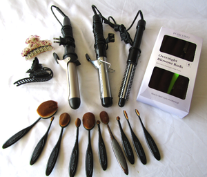 lot 603 image: Curling irons, hair clips and more as shown