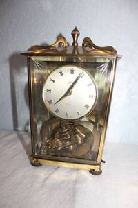 lot 15 image: Vintage German brass clock (needs string for spinners)