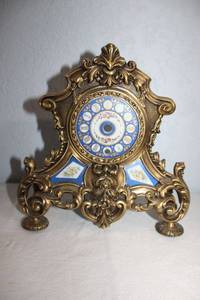 lot 22 image: Brass and porcelain face mantle clock frame only (needs workings)