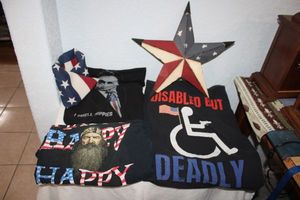 lot 55 image: Patriotic lot flag, metal star with flag design, and T-shirts as shown