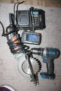 lot 92 image: Tools Worx electric saw, Hercules drill with charger (but needs new battery)