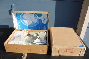 lot 127 image: Two 12 table fans by Lasko