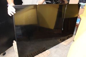 lot 130 image: 75 Sony TV with wall mount, model XBR-75X850D