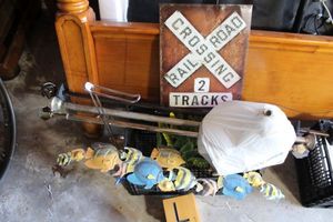 lot 205 image: Shower curtain rods, metal signs, painted canvas, TP holder