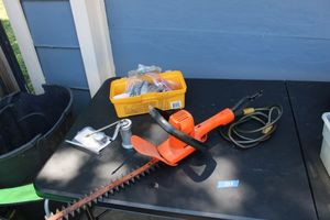 lot 222 image: Yard hedge trimmer, vinyl locking cable, oil can and mixed electrics