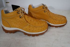 lot 556 image: Red Diamond light brownbuttercup color tennis shoes size 10