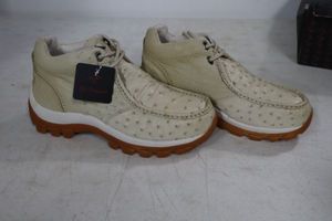 lot 561 image: Red Diamond bone color tennis shoes size 7.5