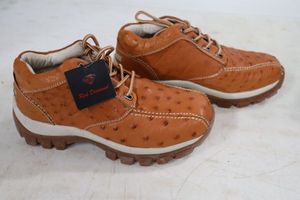 lot 562 image: Red Diamond brown color tennis shoes size 7.5