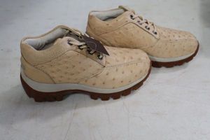 lot 567 image: Red Diamond bone color tennis shoes size 8
