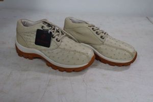 lot 569 image: Red Diamond bone color tennis shoes size 7