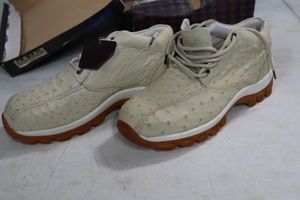 lot 574 image: Red Diamond bone color tennis shoes size 10