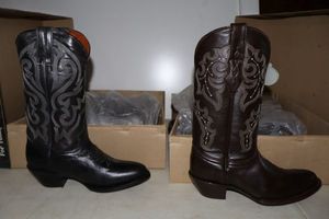 lot 1033 image: Two cowboy boots size 6 with round toe brown and black colors (2 times the money)