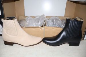 lot 1045 image: Two pairs of short boots size 9.5 velvety leather in bone and smooth black (2 times the money)