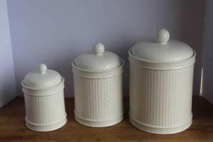 lot 7 image: basketweave canisters, featuring a textured white finish.and the middle ones lid has a small chip seen in 3rd picture