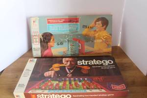 lot 29 image: Milton Bradley Stratego board game box featuring a classic illustration of a military leader.& Milton Bradley Battleship game