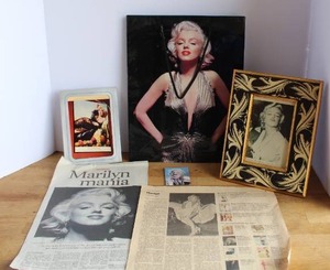 lot 81 image: vintage-style Marilyn Monroe memorabilia features black and white photograph that has writing on it that says heres to you uncle Paul see pictures for details