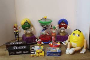 lot 118 image: a collection of vintage M&Ms fun fortune candy dispensers, including characters like the yellow M&M seated in a chair and the green M&M fortune teller and more see pictures