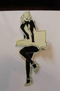 lot 135 image: Marilyn Monroe pendulum wall clock