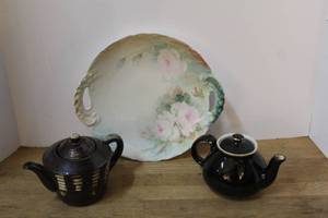 lot 137 image: vintage black ceramic teapots,and cake plate features a hand-painted floral design with pink roses and delicate slotted handles