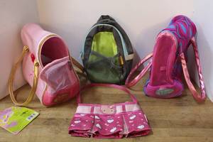 lot 144 image: plush puppy  carrying bags and a hello Kitty bag and more see pictures